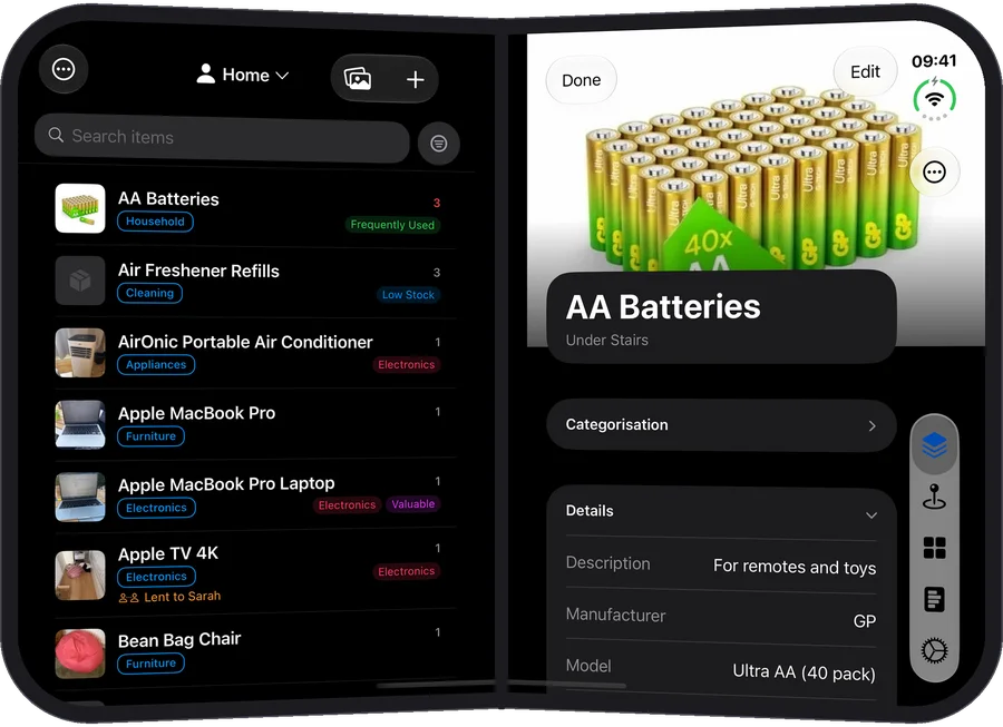 The iPhone Duo on its side, the items list on the left page and AA Batteries open on the right